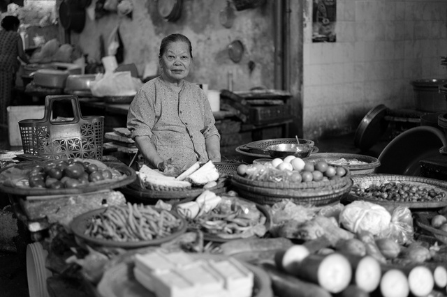 A woman at the market of Hue