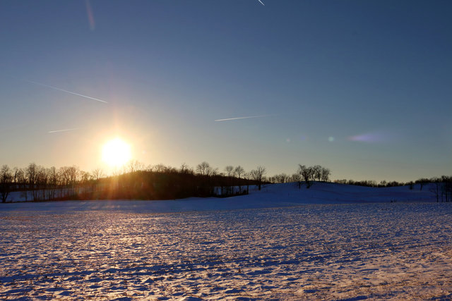 Sun flares and vapor trails, southern Ohio