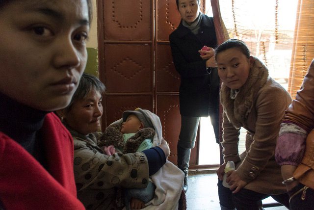 Patients inside a Traditional pharmacy, Dali, Yunnan