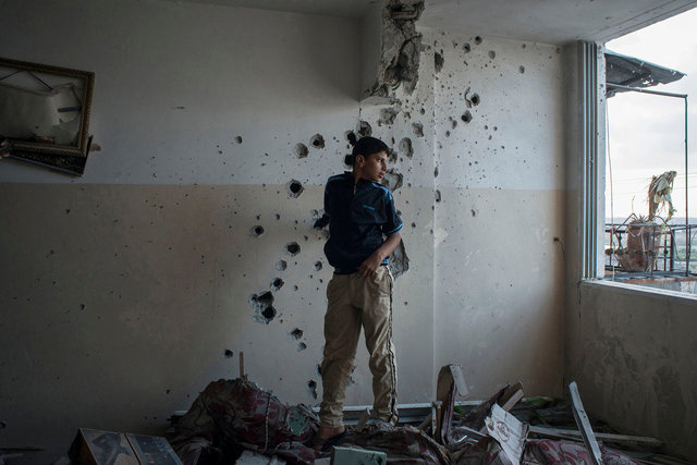 Baha'a Ali Meqbel in the house of his neighbourhood Ra'ed Aldaor, Beit Lahya, the Gaza Strip.