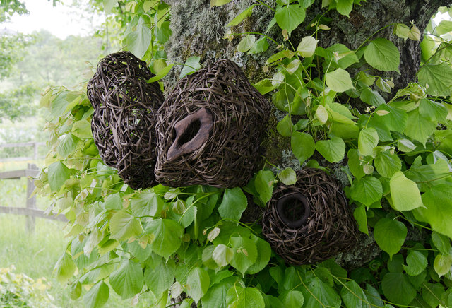 Installation from wood and rattan on the trees of the alley in Nääs, Sweden. 2015