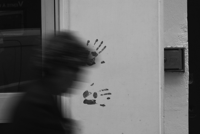 two hands on a wall